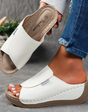 Comfortabele leren slippers met dikke zool en voetboogondersteuning.