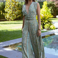 Isla Luxe – Jumpsuit met print, open rug en wijde pijpen